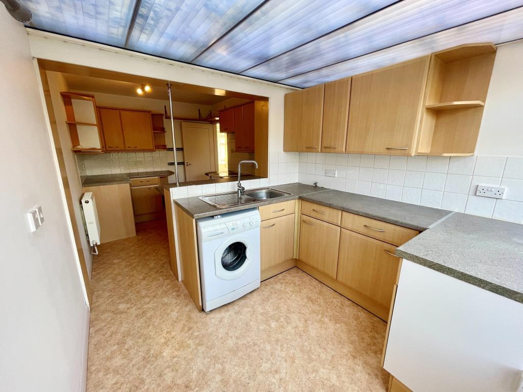 Lot: 143 - FOUR-BEDROOM SEMI-DETACHED HOUSE - Kitchen area in lean-to